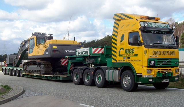 Low-loader transport for heavy construction plant.