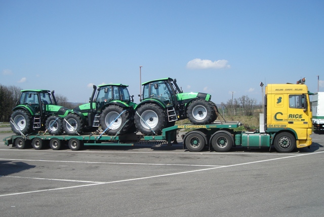 Multiple tractors carried in a single planned movement.