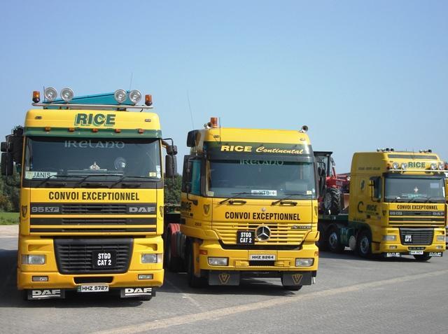 Three generations of yellow Rice tractor units.